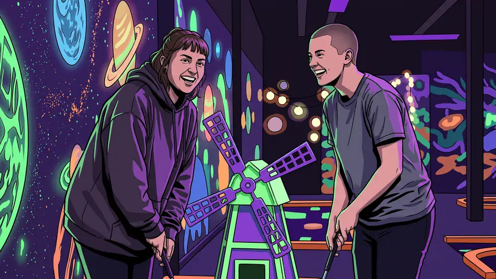 GolfZone Schwarzlicht Minigolf in Bielefeld – Zwei Personen spielen im Neonlicht