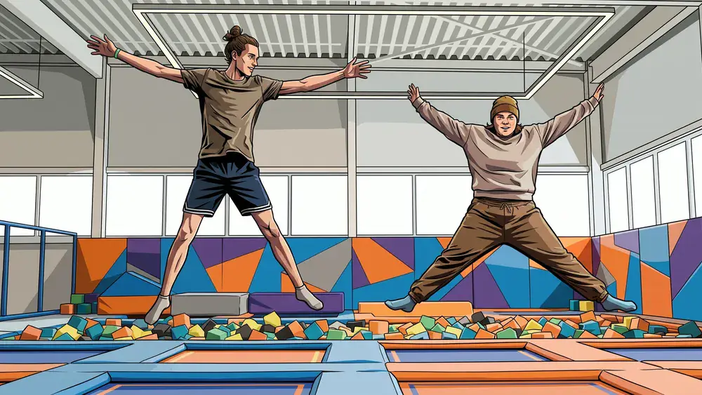 SPRUNG.RAUM Kiel – Zwei Personen springen auf Trampolinen in einem modernen Indoor-Park