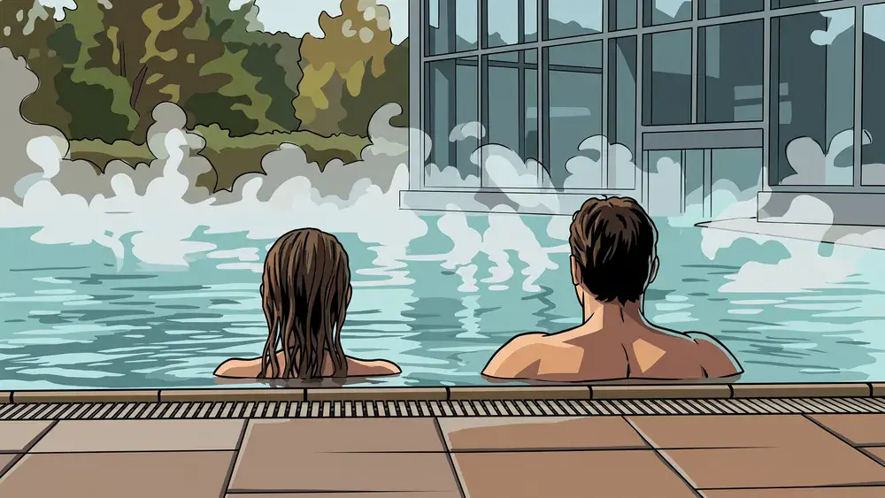 Claudius Therme in Köln – Zwei Personen entspannen im Thermalbecken mit Blick in den Rheinpark